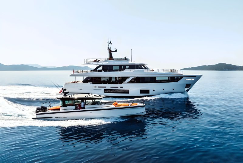 Luxury motor yacht AT ONE cruising with chase boat